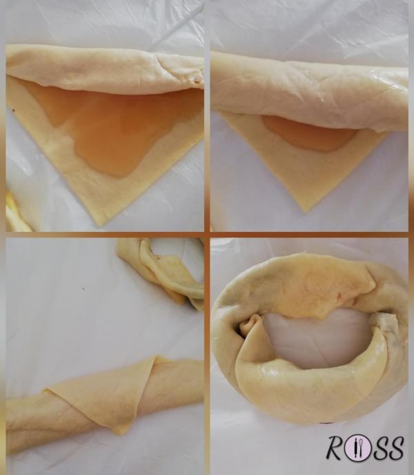 Arrotolate ogni spicchio partendo dal lato più lungo, fino ad ottenere un rotolo con la punta finale verso l'alto. Poi unite i due lembi fino ad ottenere una ciambella. (seguite la figura) sigillate bene le varie fessure che si creano tra i vari strati arrotolati. In questo modo eviterete che il miele si cosparga fuori durante la cottura. 